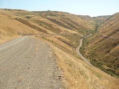 Road heads down the valley and curves back